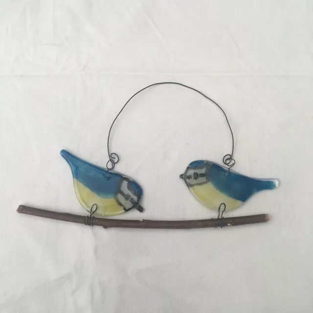 2 blue tits on a twig