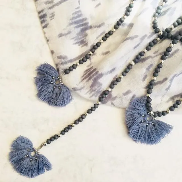 Long blue bead and tassel necklace