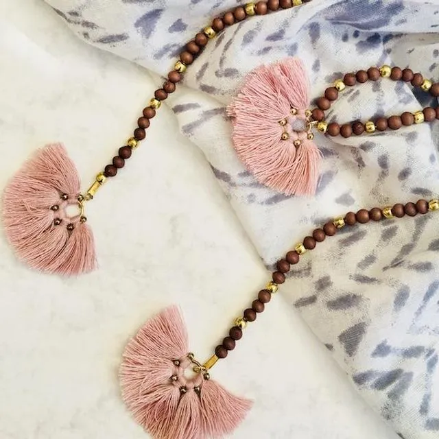 Long pink bead and tassel necklace