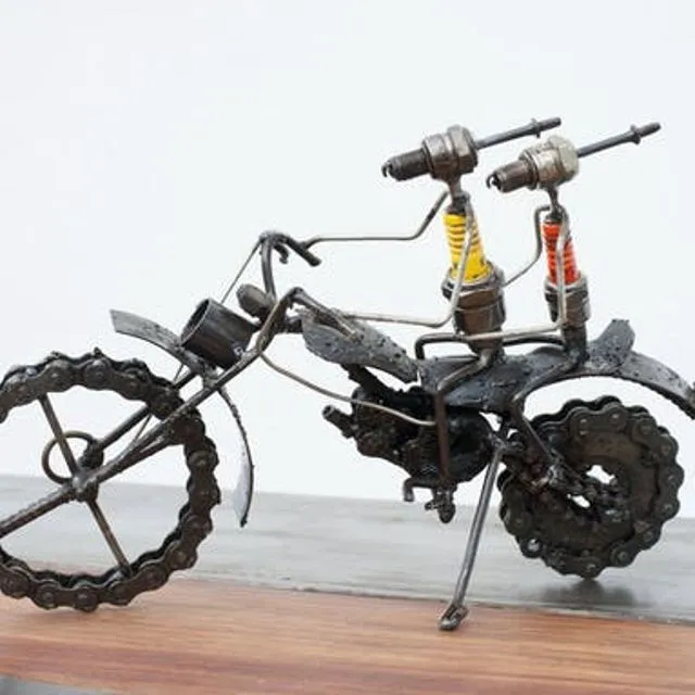 Motorcyclists made from recycled spark plugs and motorcycle parts