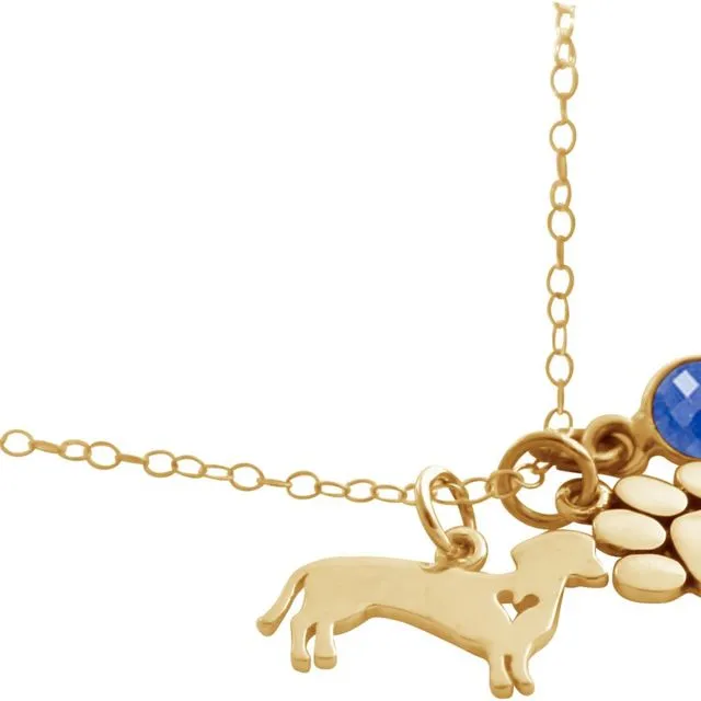 Gemshine dachshund and paw paw pendant with blue sapphire gemstone. Solid gold-plated a 45cm necklace