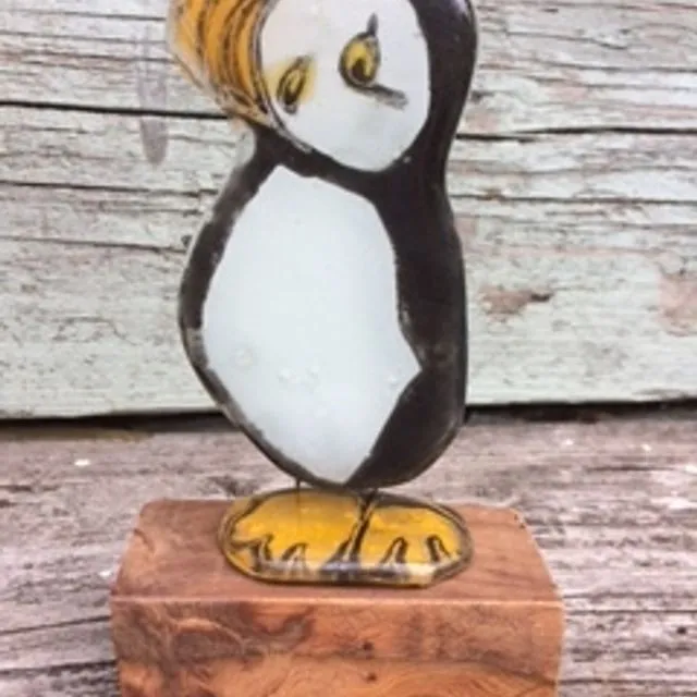 Puffin on wooden block