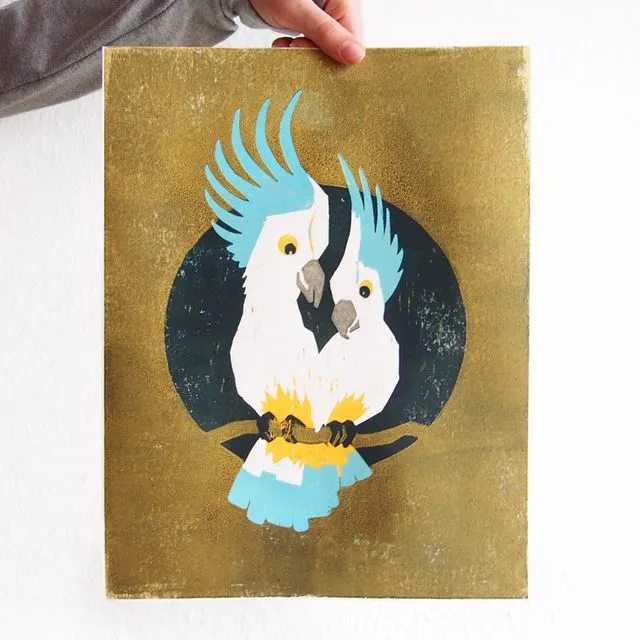 Hand-printed woodcut print with two cockatoos (gold)