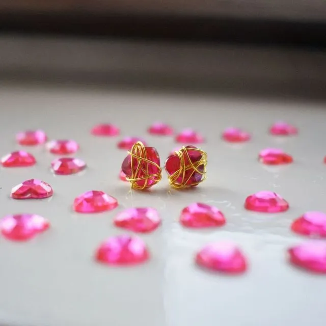 Pink Bunmi wraps golden stud earrings
