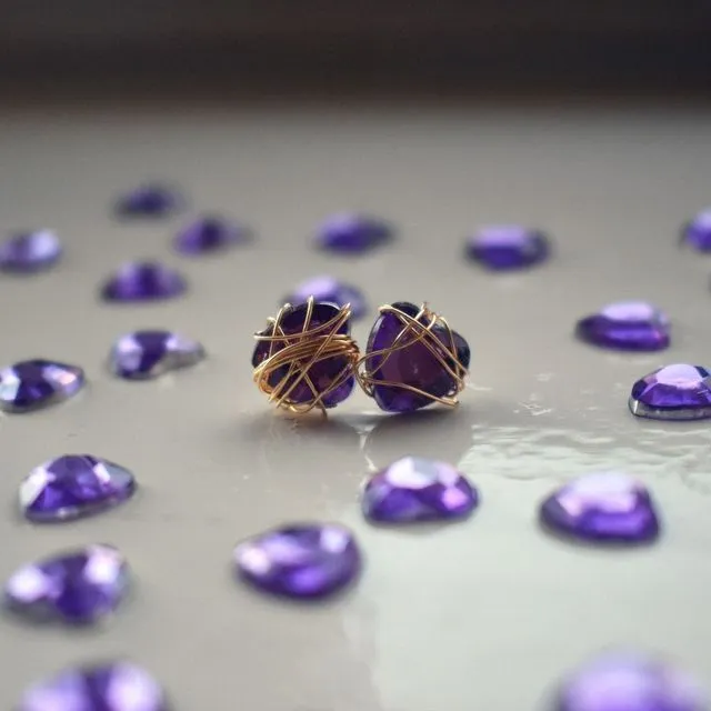 Purple Bunmi wraps golden stud earrings