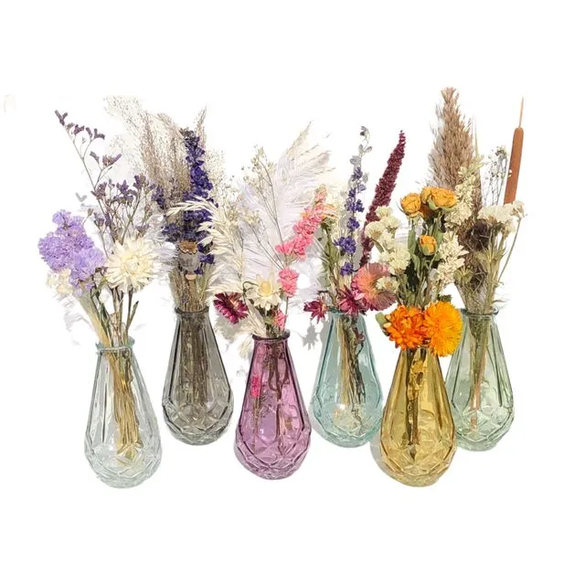 Vase with a small bouquet of dried flowers.