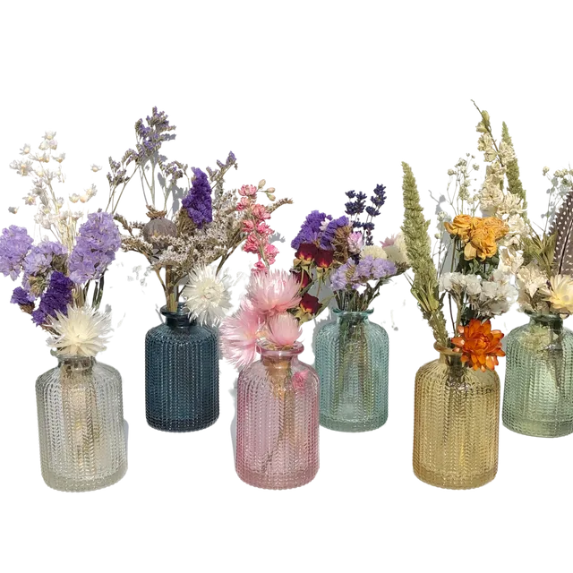 Small bottle with mini bouquet of dried flowers