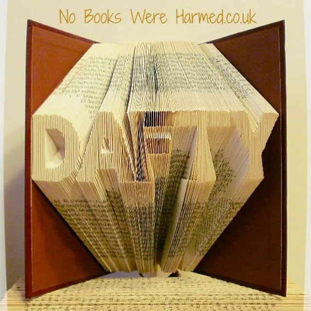 "DAFTY" hand folded into the pages of book : : Offensive Art : : Crude Books