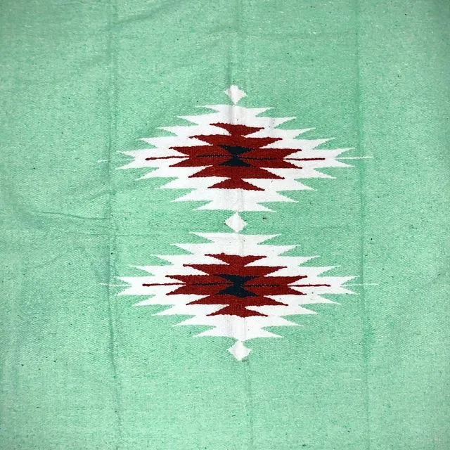 The In/Out "Diamante" Blanket Solid Turquoise with Small Rust Diamonds