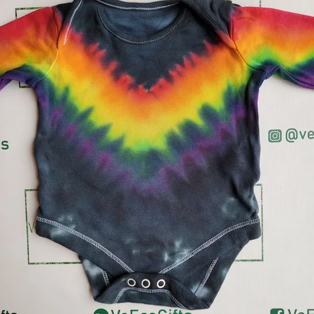 Hand tie dyed rainbow stripe pattern 100% cotton long sleeve baby grow, available in 0 -24 months
