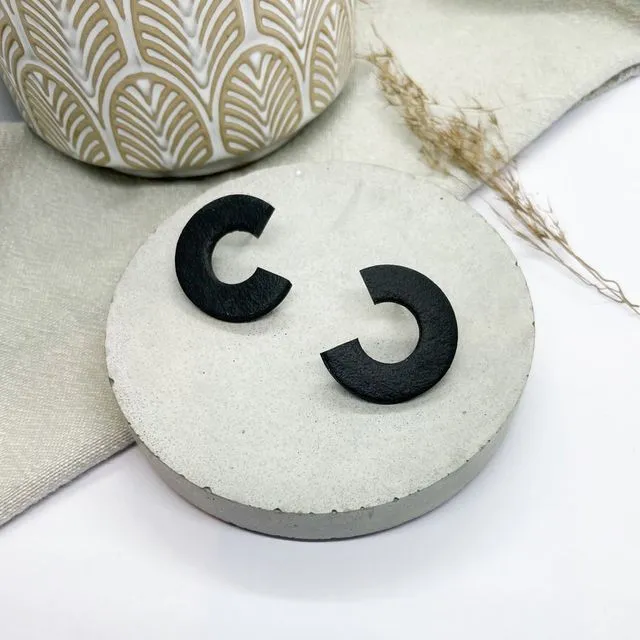 Black polymer clay stud earrings, leather effect studs