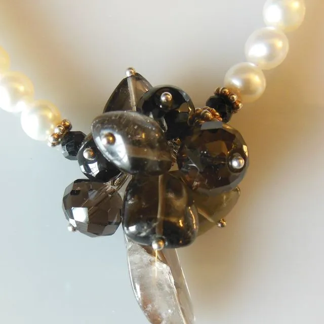 Smoky quartz cluster on white pearls