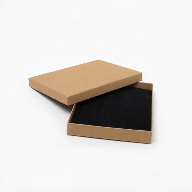 Naturla brown paper gift box  Black flock inner with top corner slits for a chain and holes for earrings  This box is recyclable and the foam insert is removable  External Dimensions 14x11x2cm  Internal Dimensions Base : 13.5x10.5x1.8cm Lid: 14x11x1.4cm Thickness of foam insert: 0.8cm