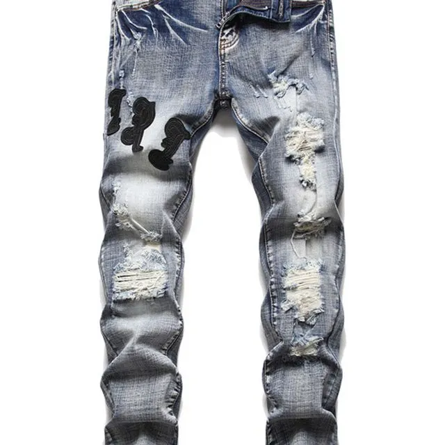 Patches Ripped Slim Tapered Jeans