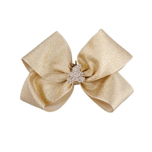 Large double shimmery satin bow with gold teddy rhinestone on a alligator clip.