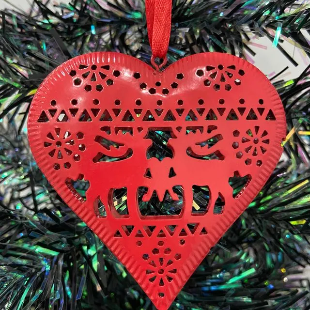 Handmade double sided red metal star with an intricate reindeer pattern