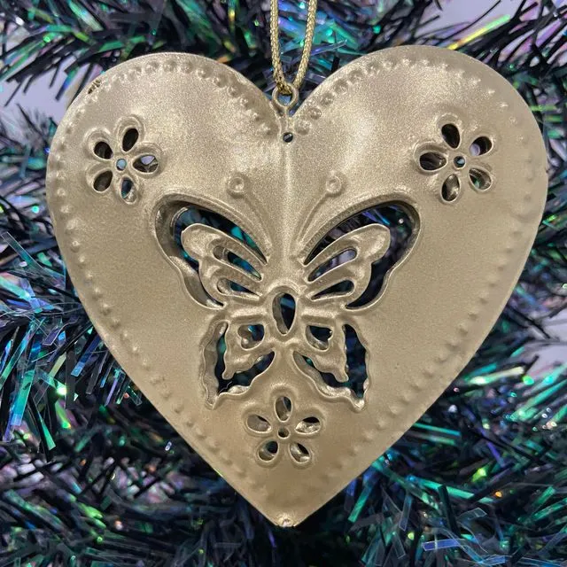 Handmade double sided gold metal heart with an intricate butterfly and flower pattern