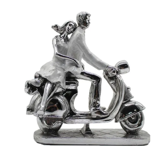 Silver couple on Motorbike
