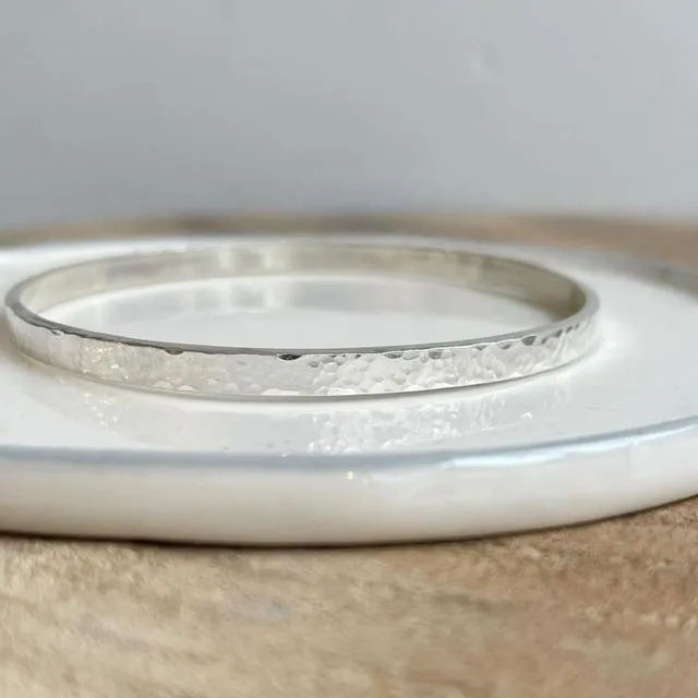 Hammered flat bangle in sterling silver