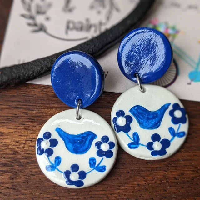 Blue and white earrings with hand drawn birds
