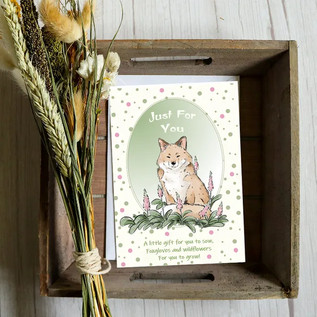 Fox and wild flowers.Greeting card with a gift of seeds.